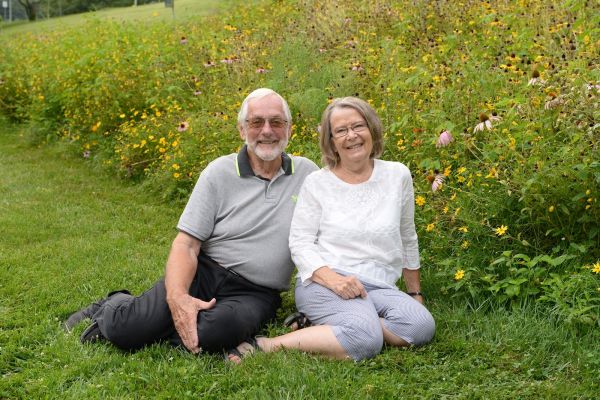 Esophageal patient William Strunk and his wife Patricia, pose in a fieldE