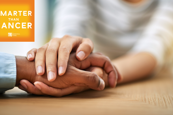 Two people holding hands with the Smarter than Cancer logo in the left corner