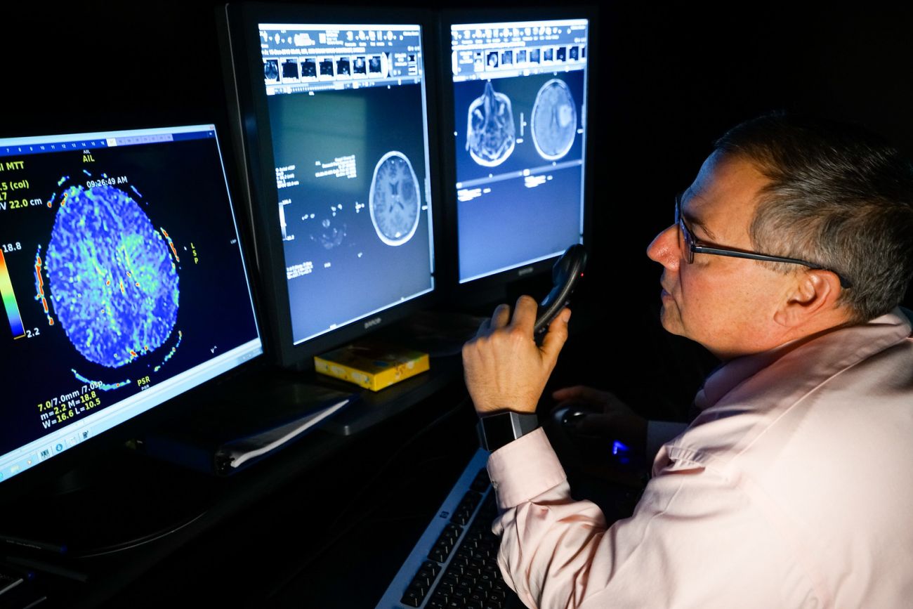 Dr. Ronald Alberico looking at a brain scan