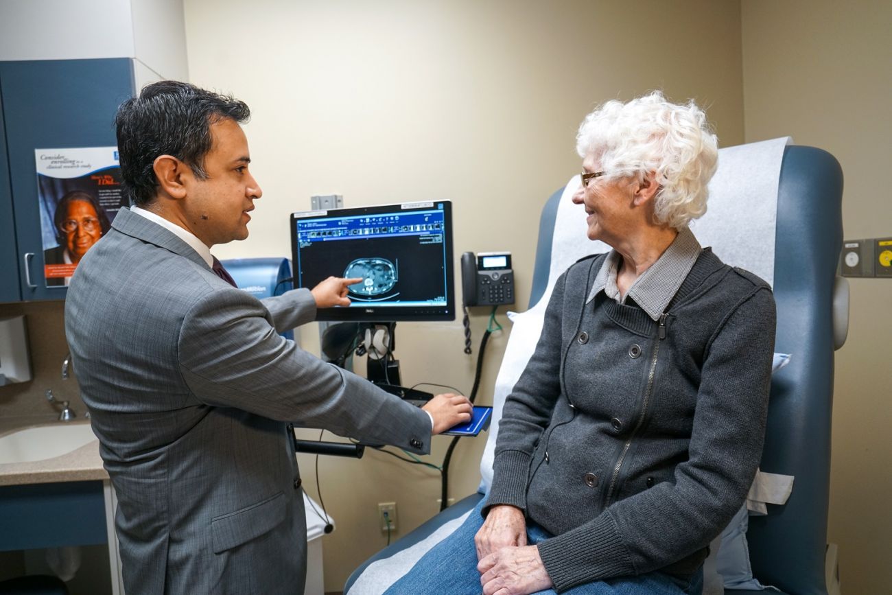 Moshim Kukar and Patient in Clinic