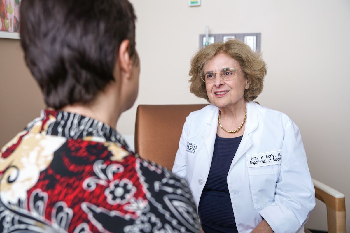 Dr. Amy Early in clinic with a patient