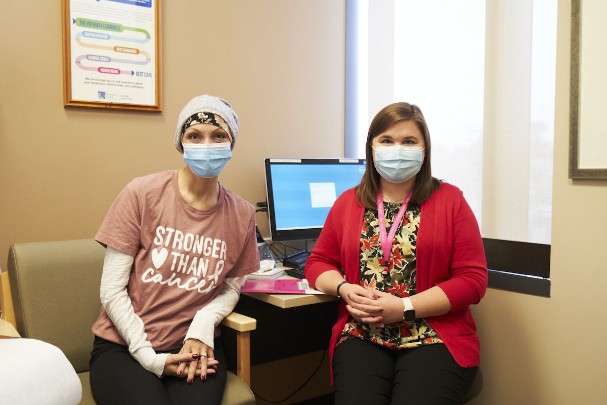 Christina Rauber, left, meets in the Breast Center with Clinical Pharmacist Specialist Christina Matthews, PharmD, BCOP. The two keep in close touch while Christina Rauber is in treatment.