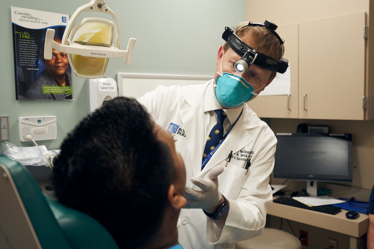 Dr. Ryan McSpadden in clinic with patient.