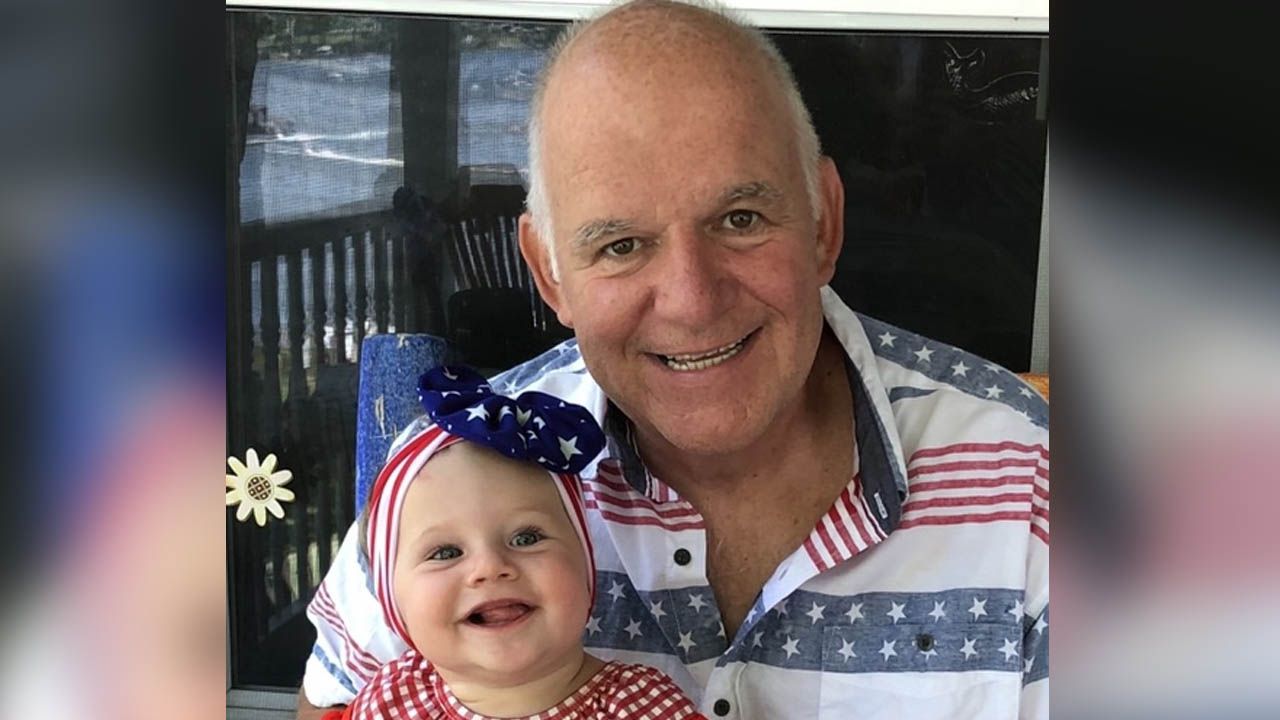 Patient Doug Green with his granddaughter 