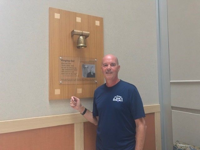 Mark Murdoch ringing the Victory Bell.