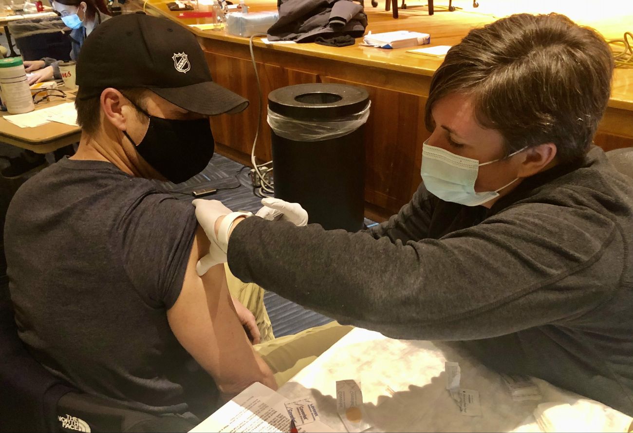 Buffalo Firefighter Chris Whelan gets the COVID-19 vaccine at Roswell Park