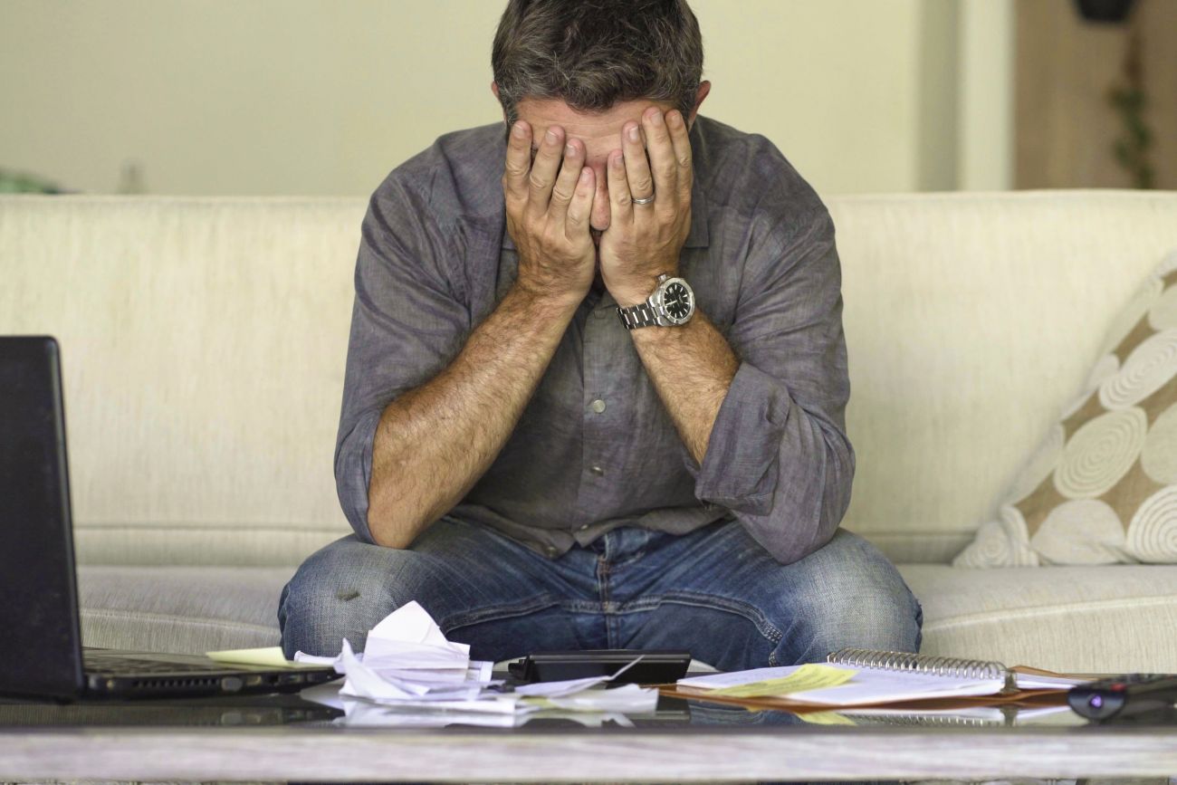 Worried man with paperwork