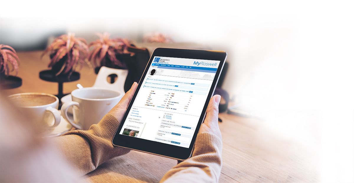 image of person using the MyRoswell patient portal on a tablet