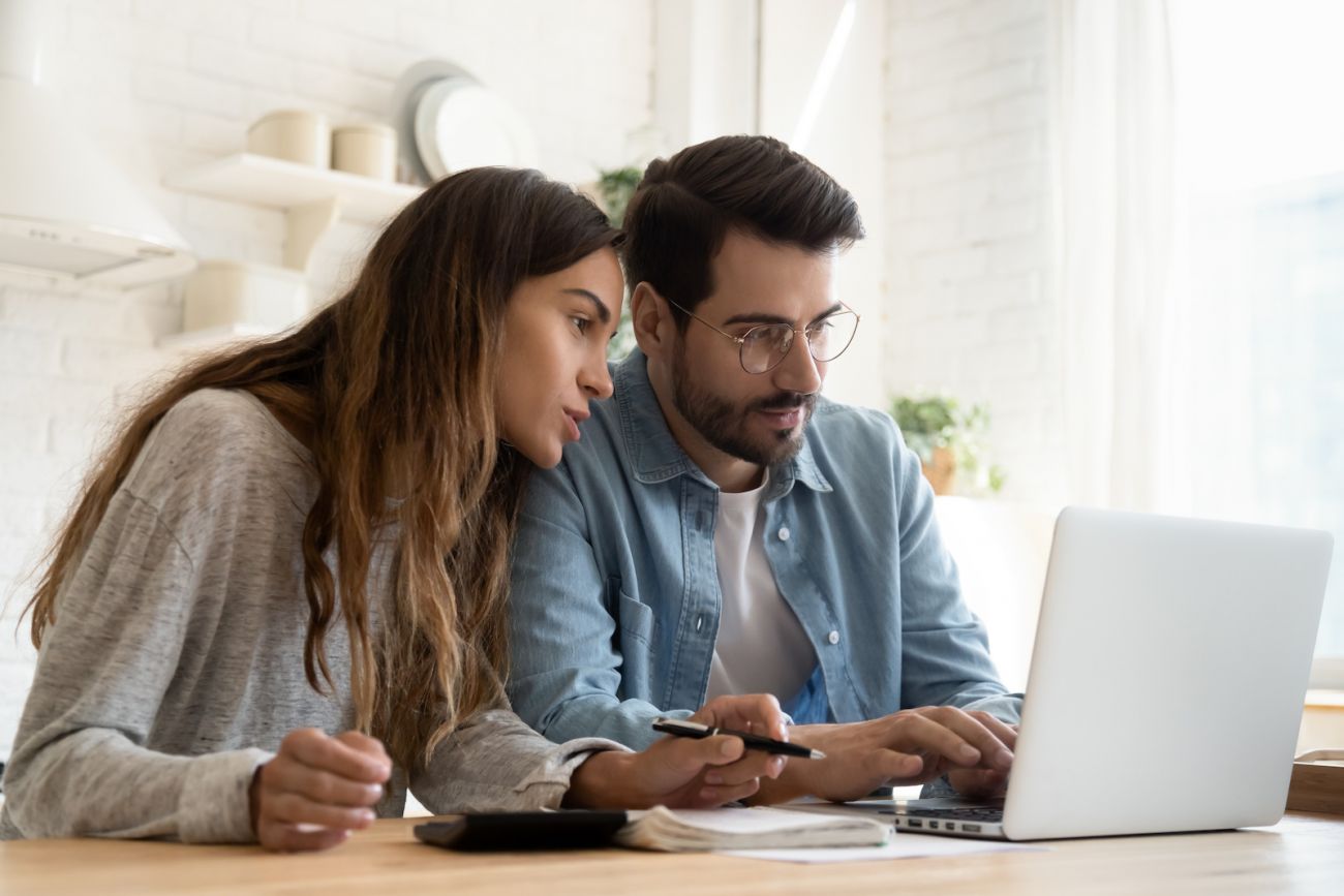 Young couple looking at a laptop