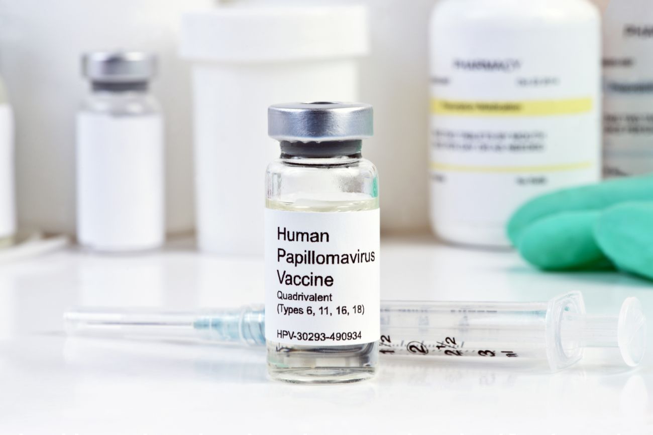 Bottle of HPV vaccine inn  front of a syringe