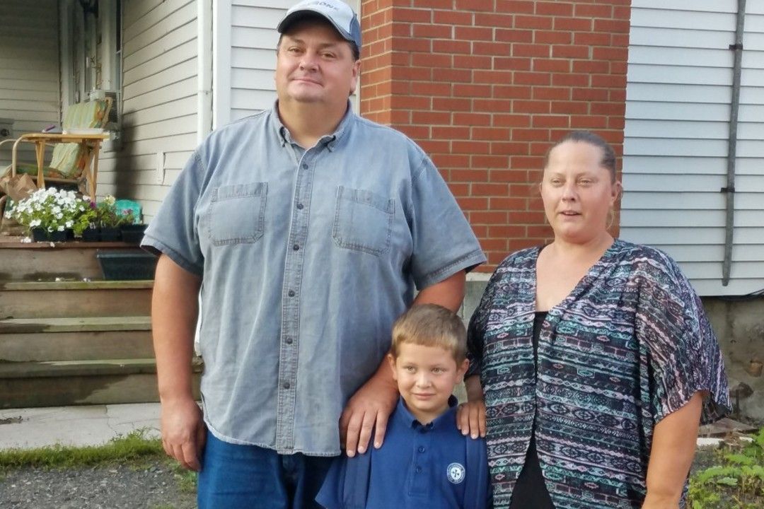 Katie Maerten, left, with her boyfriend, Paul Strobel, and their "miracle" son, Steven. 