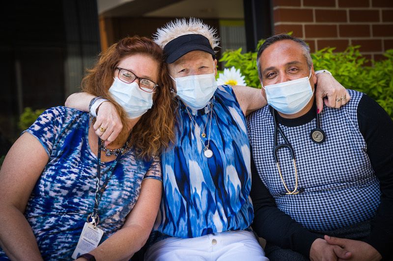 photo of Prudie hugging her physician and nurse practitioner