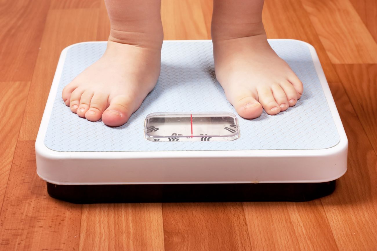 Child being weighed on a scale