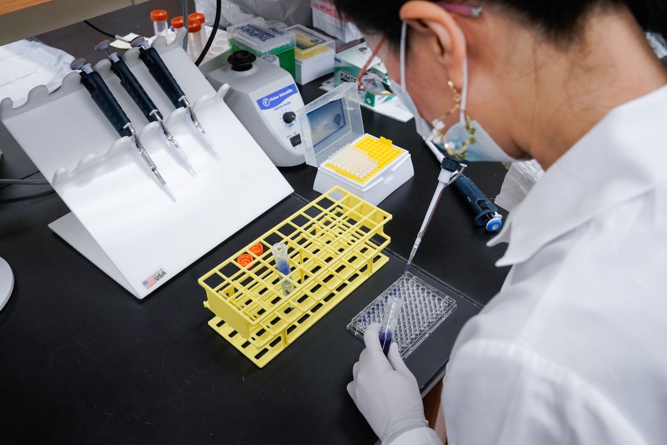 Scientist working with test tubes