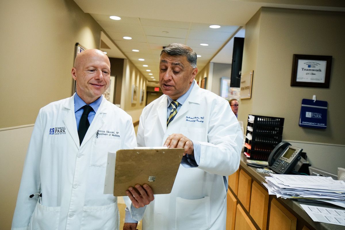 Two doctors discussing a patient's chart