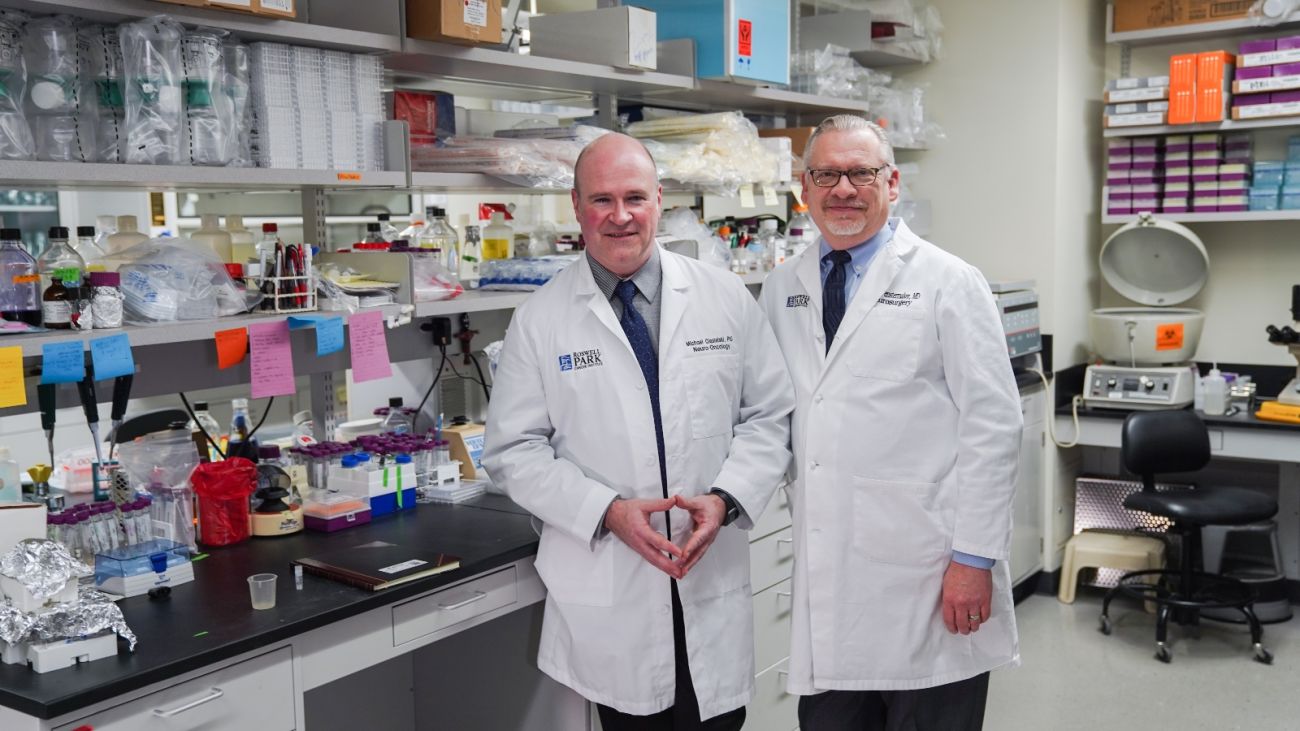 two doctors stand in a lab