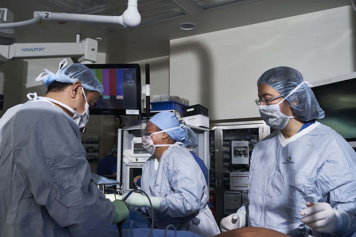 Dr. Moshim Kukar performing surgery with DaVinci robot