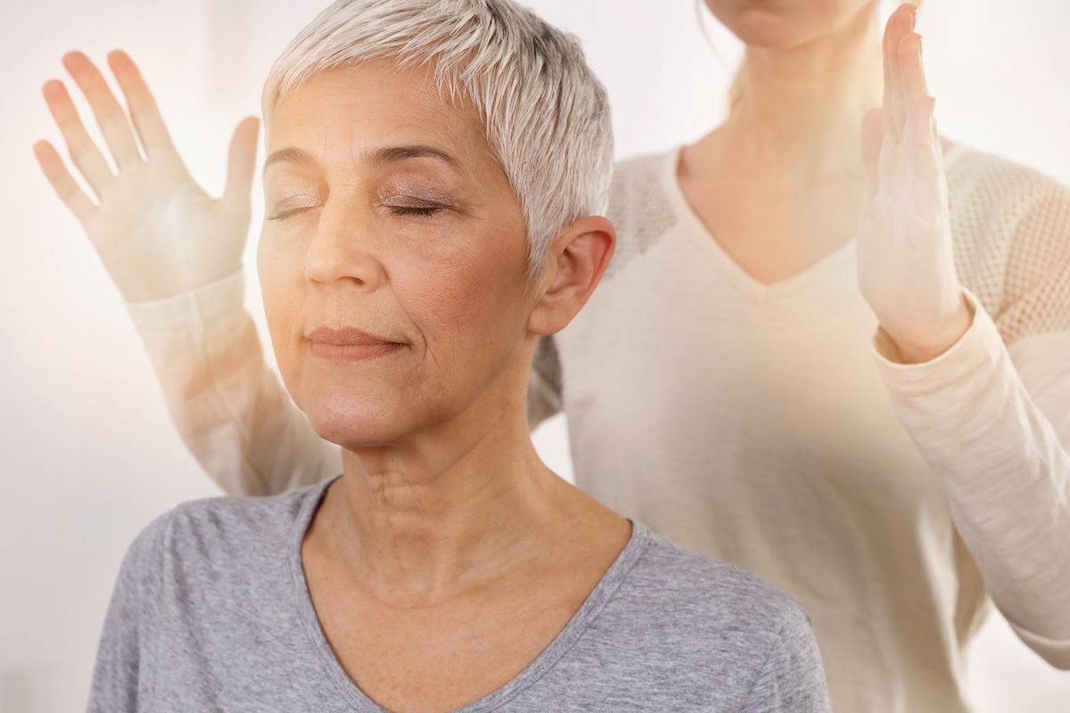 image of woman in Reiki session