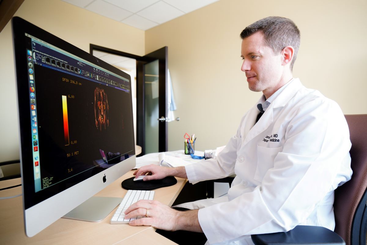 Doctor in front of computer screen 