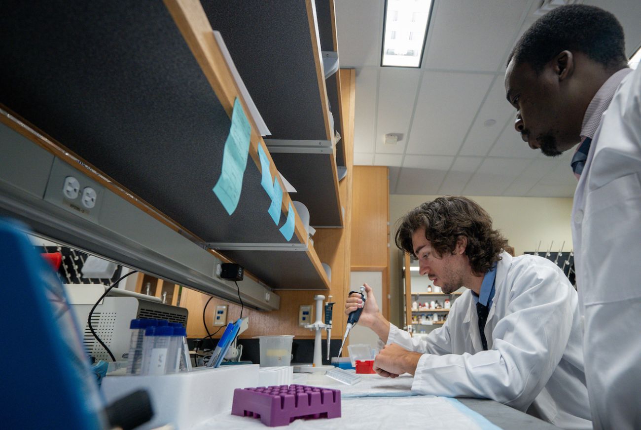 Scientists working on a lab table