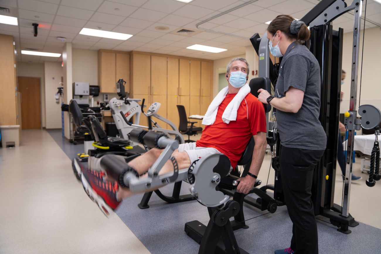 Patient works with physical therapist in rehabilitation clinic - 2020