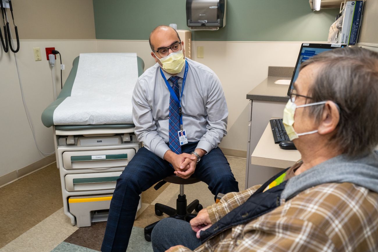 Dr Ahmed Aly in-clinic with patient - September 2022