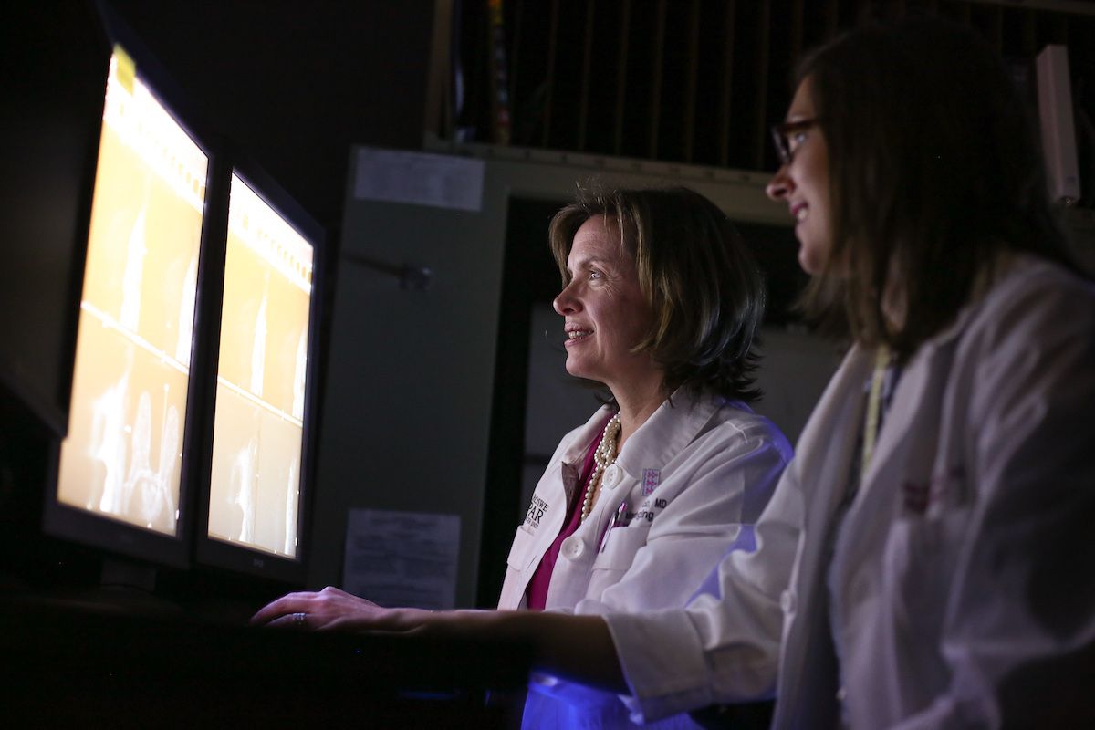Dr. Ermelinda Bonaccio and Dr. Sara Majewski review a screening mammography image