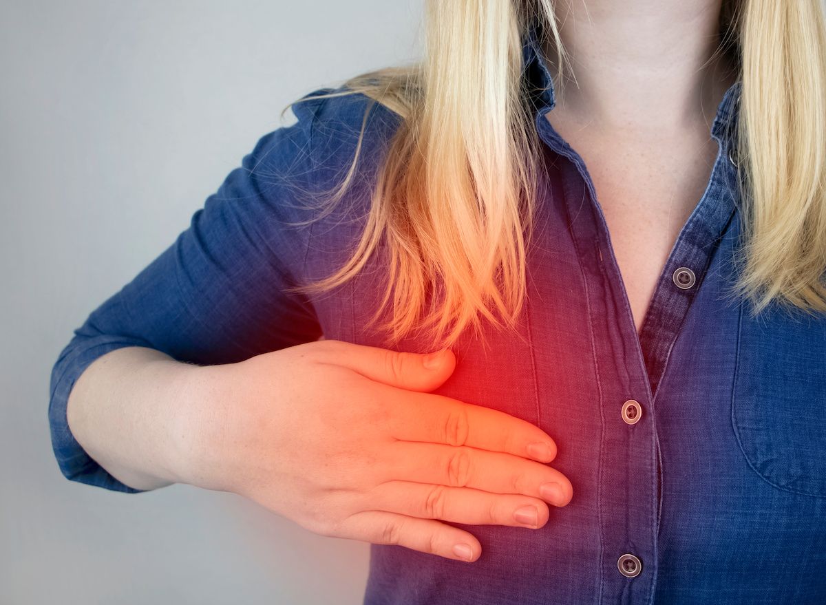 Woman experiencing pain in her breast