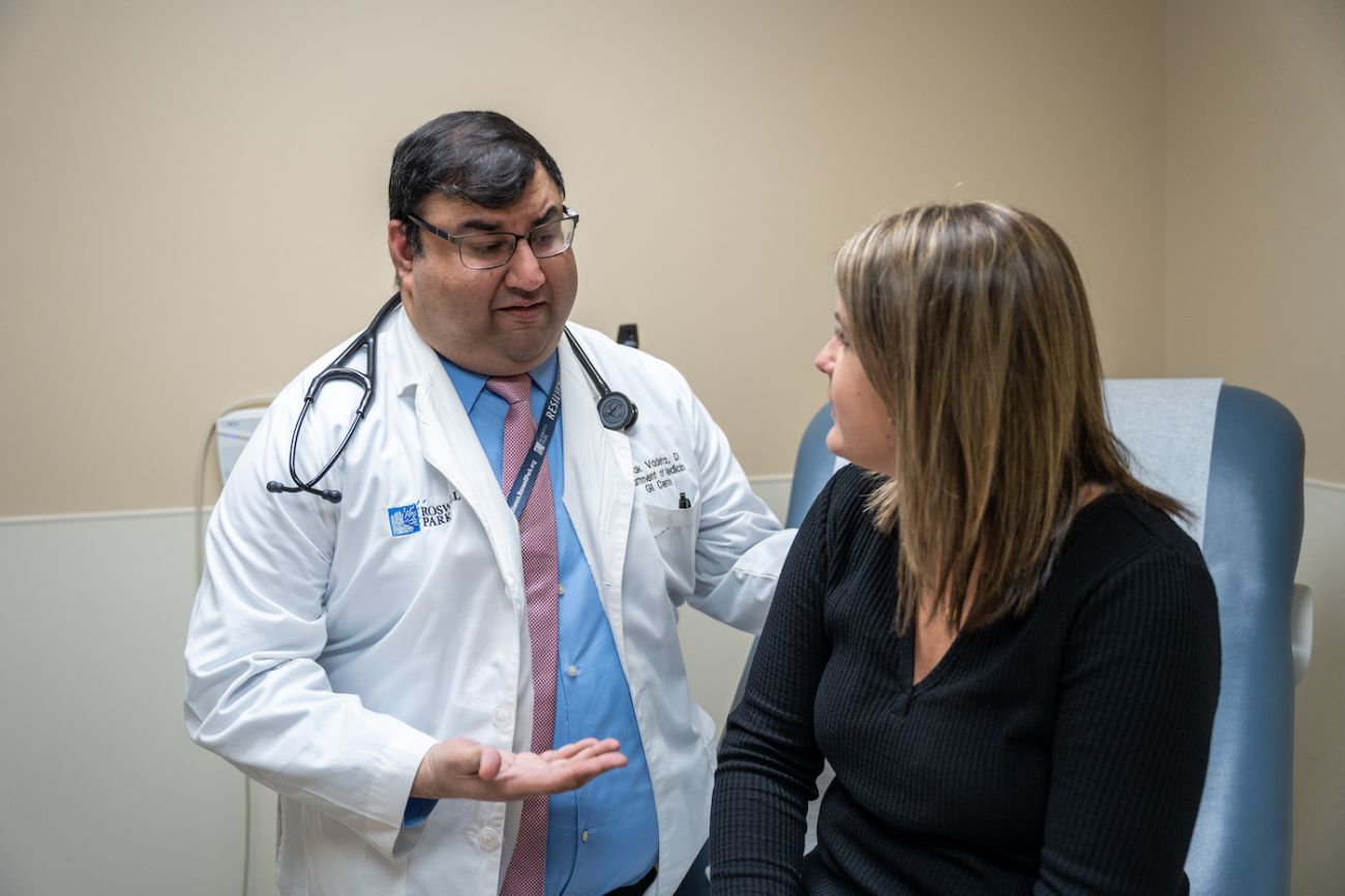 Dr. Deepak Vadehra interacts with a patient in clinic