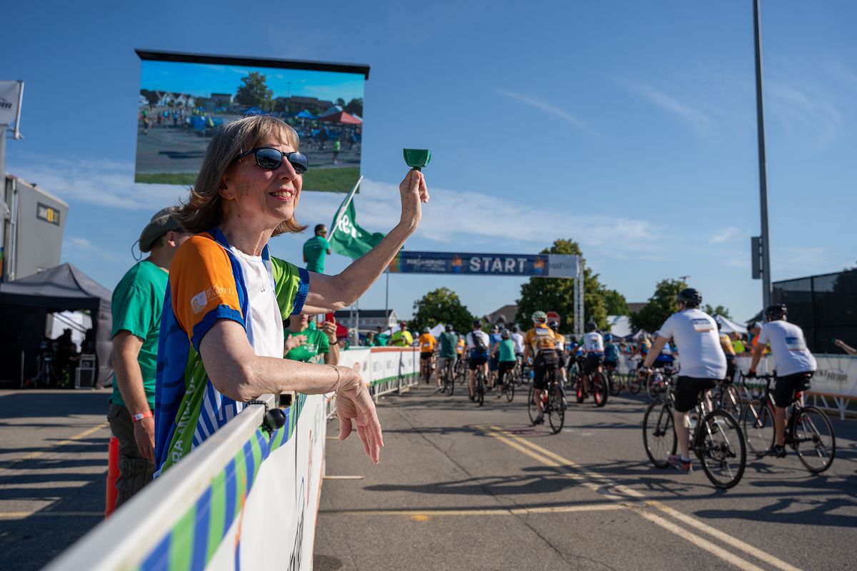 Dr. Candace Johnson ringing a bell at the Ride for Roswell