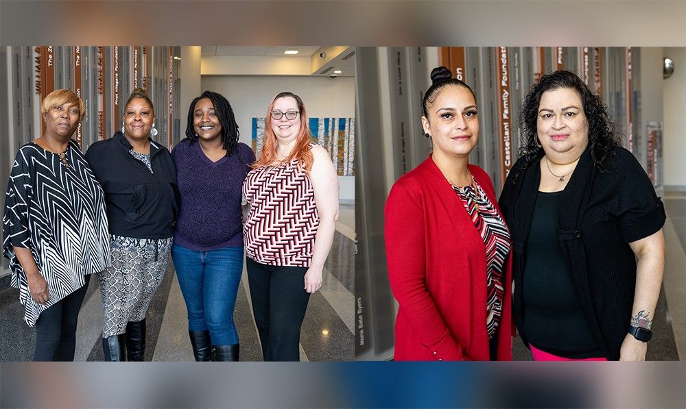 Two groups of women: the first is a group of four women standing in a lobby, the second is a group of two women standing together. 