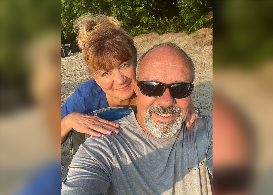 Patient Jim and his wife Barb Abbatoy pose together a beach