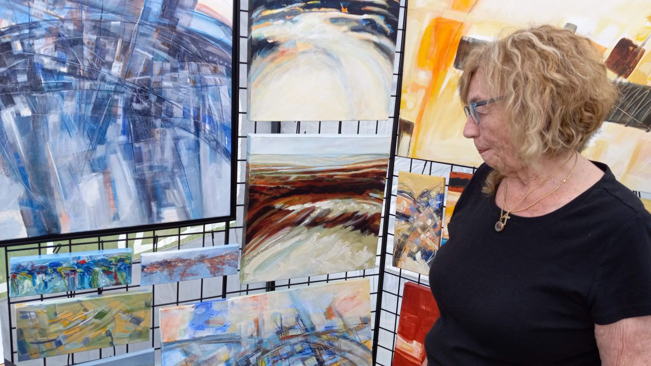 Cecilia Farrell with some of her paintings. 