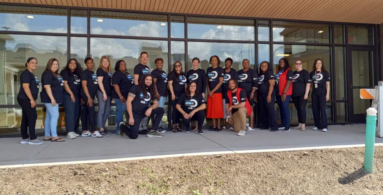 COE Team in front of the new Community Outreach & Engagement Building