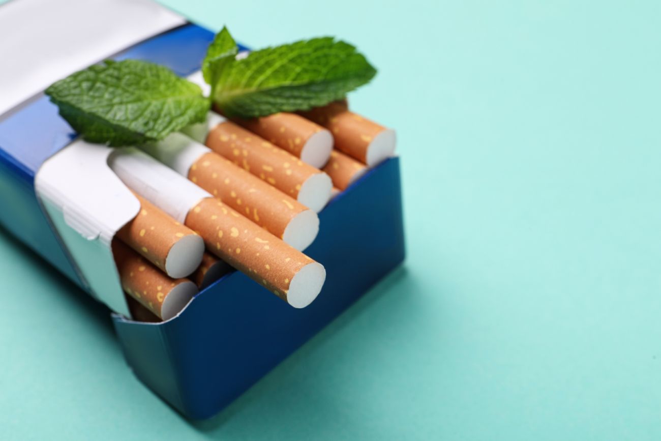 pack of cigarettes with mint leaves on top