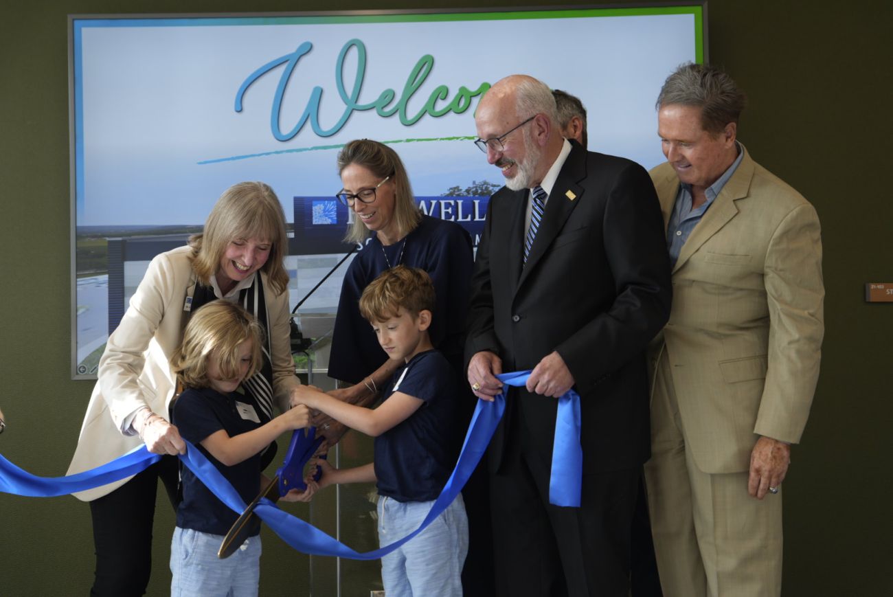 Dr. Johnson, Congressman Higgins, Scott Bieler and his family cut the ribbon to officially open the Roswell Park Scott Bieler Amherst Center.