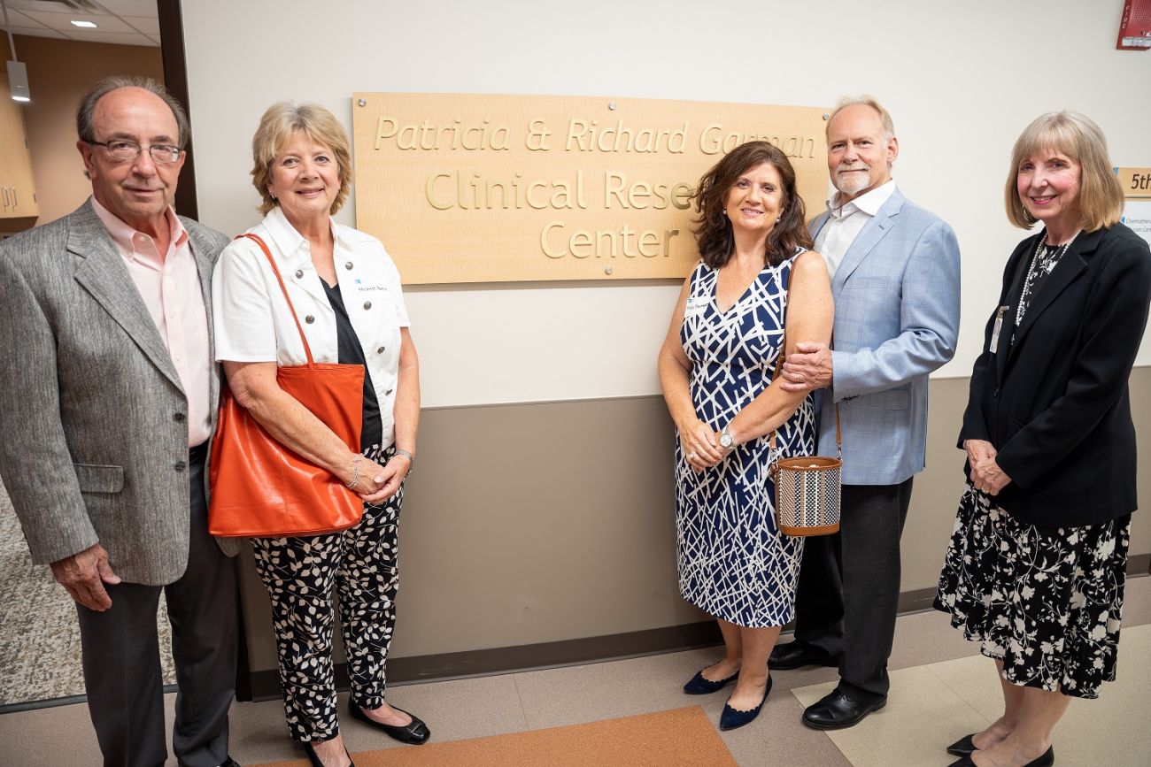 Roswell Park donors pose with Dr. Johnson in front of the newly renovated Garman Clinical Research Center.
