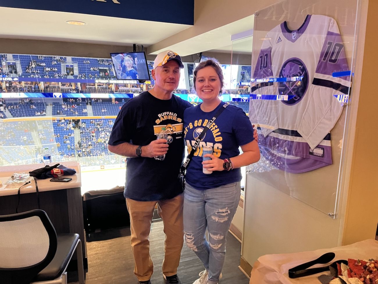 Father and daughter Gary and Emily Pacer enjoy themselves at a Buffalo Sabres game