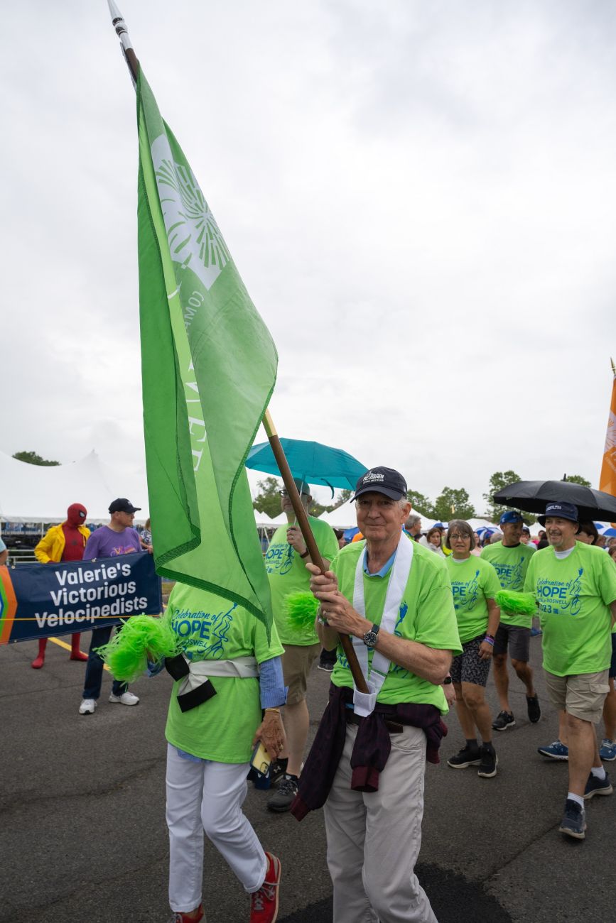 Patient Chris Vogelsang walks in the Ride for Roswell Celebration of Hope procession.