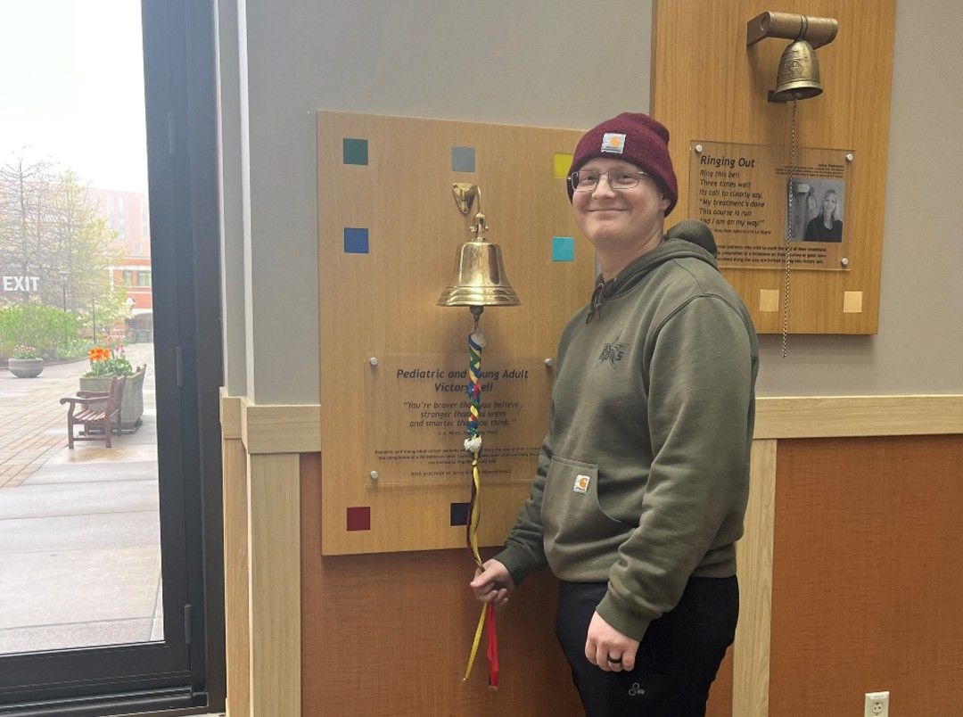 Jack Langdon rings the Victory Bell after finishing treatment.