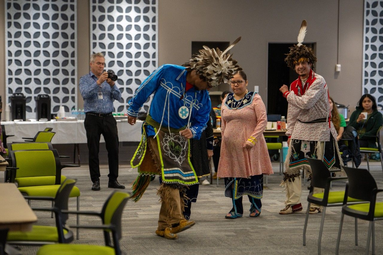 Native American dancers perform during a ceremony. 