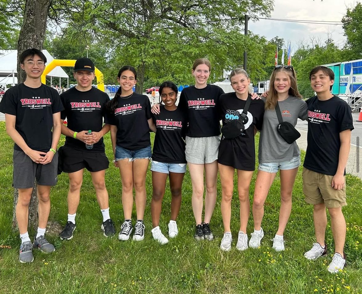 A group of high school students standing together outdoors