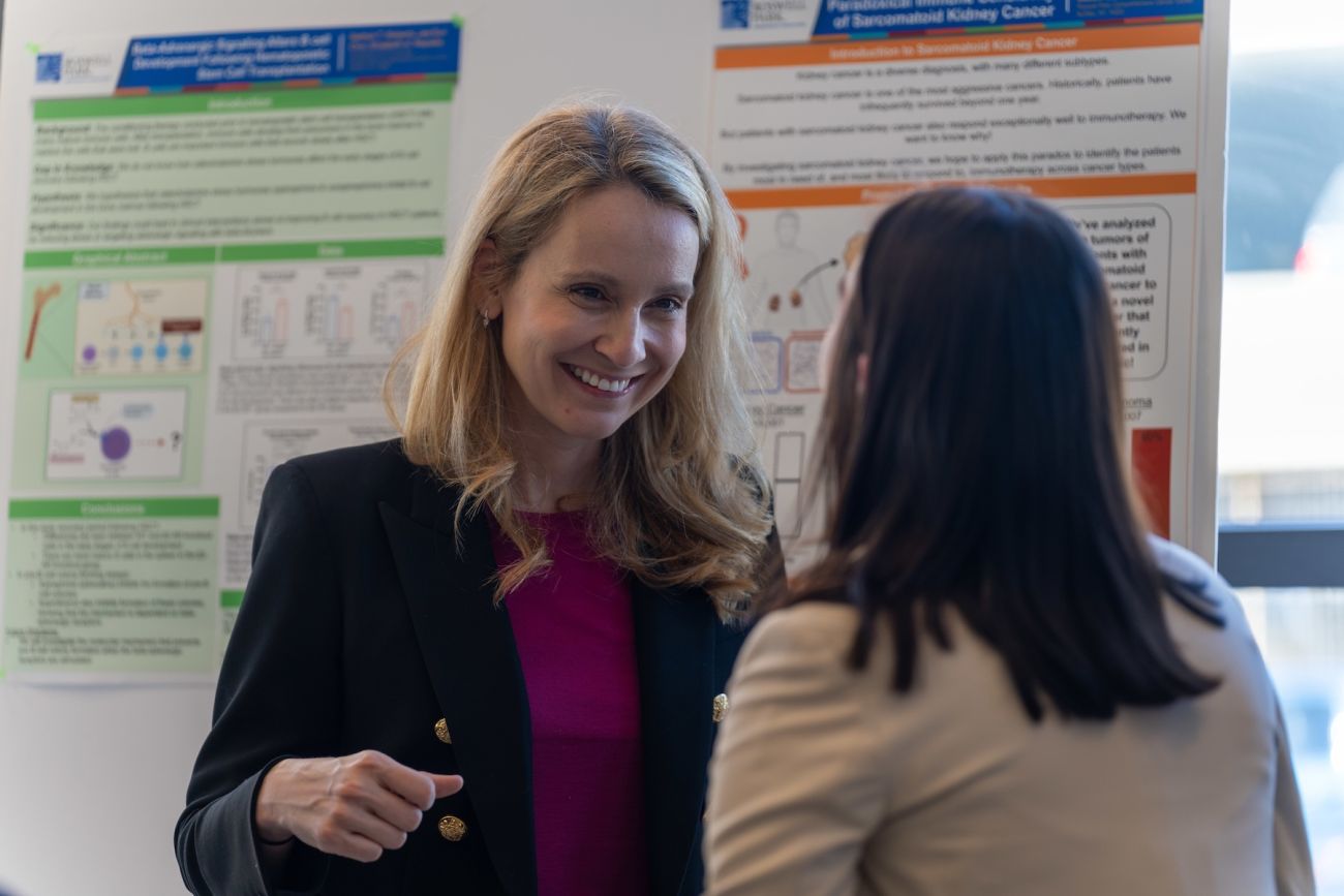 A doctor speaking to a patient at an event