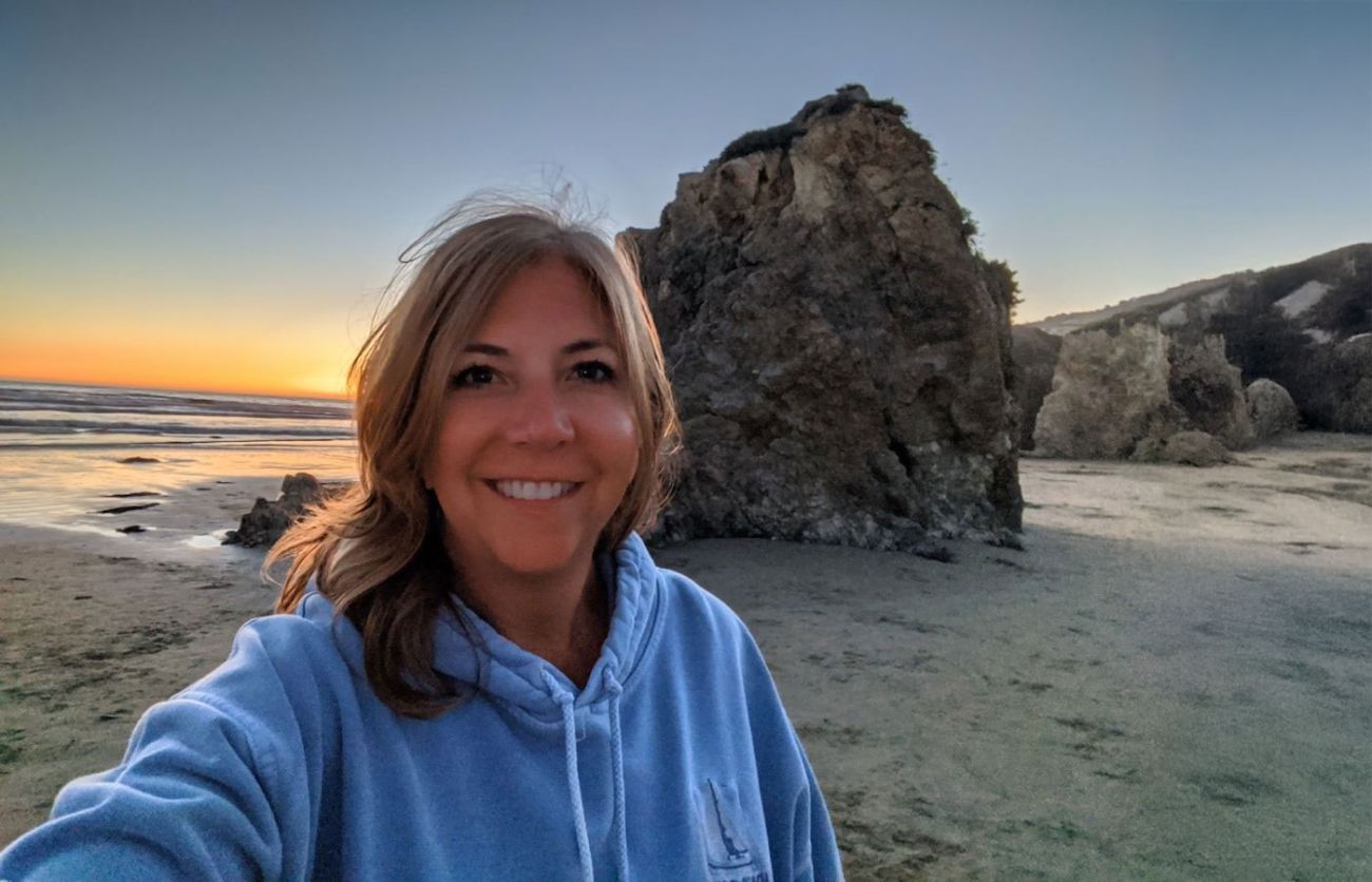woman on the beach during a setting sun