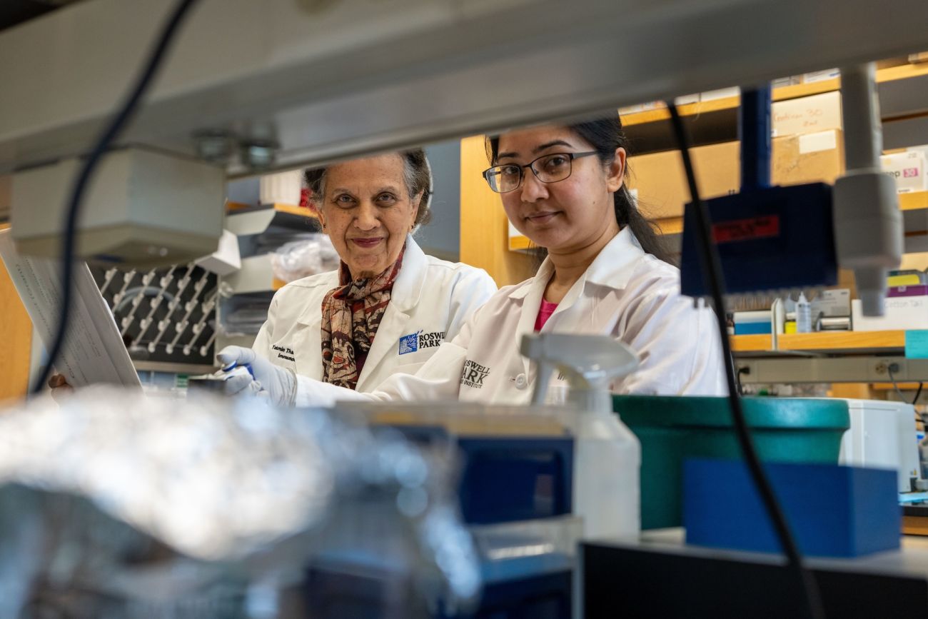 Two scientists working at a lab bench