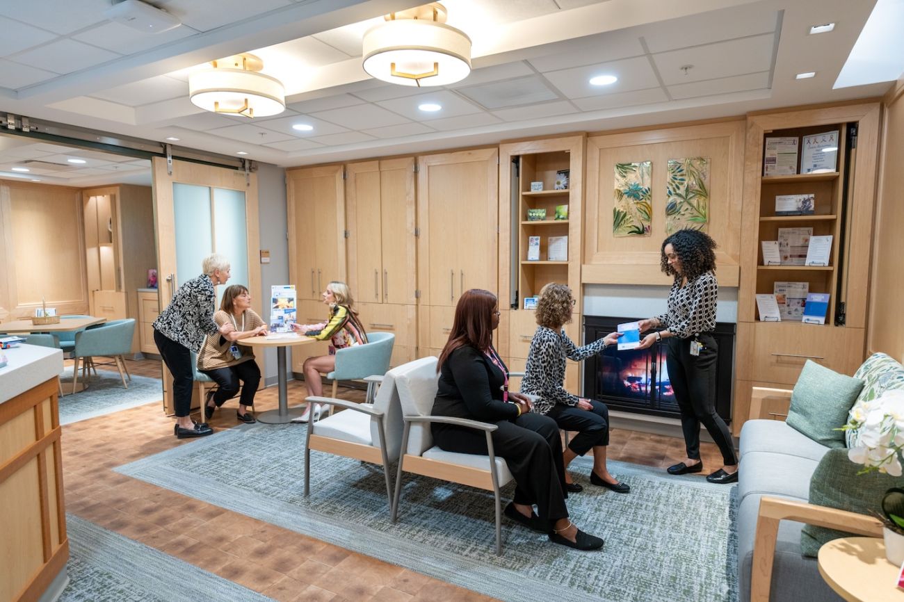 Patients and staff interact in the lobby of the 11 Day Power Play Cancer Resource Center