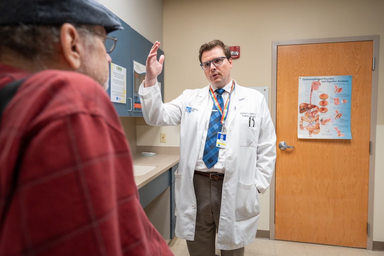Dr. Zachary Stiles speaks with a male patient