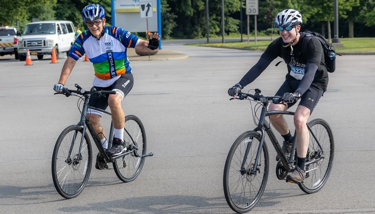 Paul Leo, left, and Dr. Jens Hillengass ride together during the Ride for Roswell.