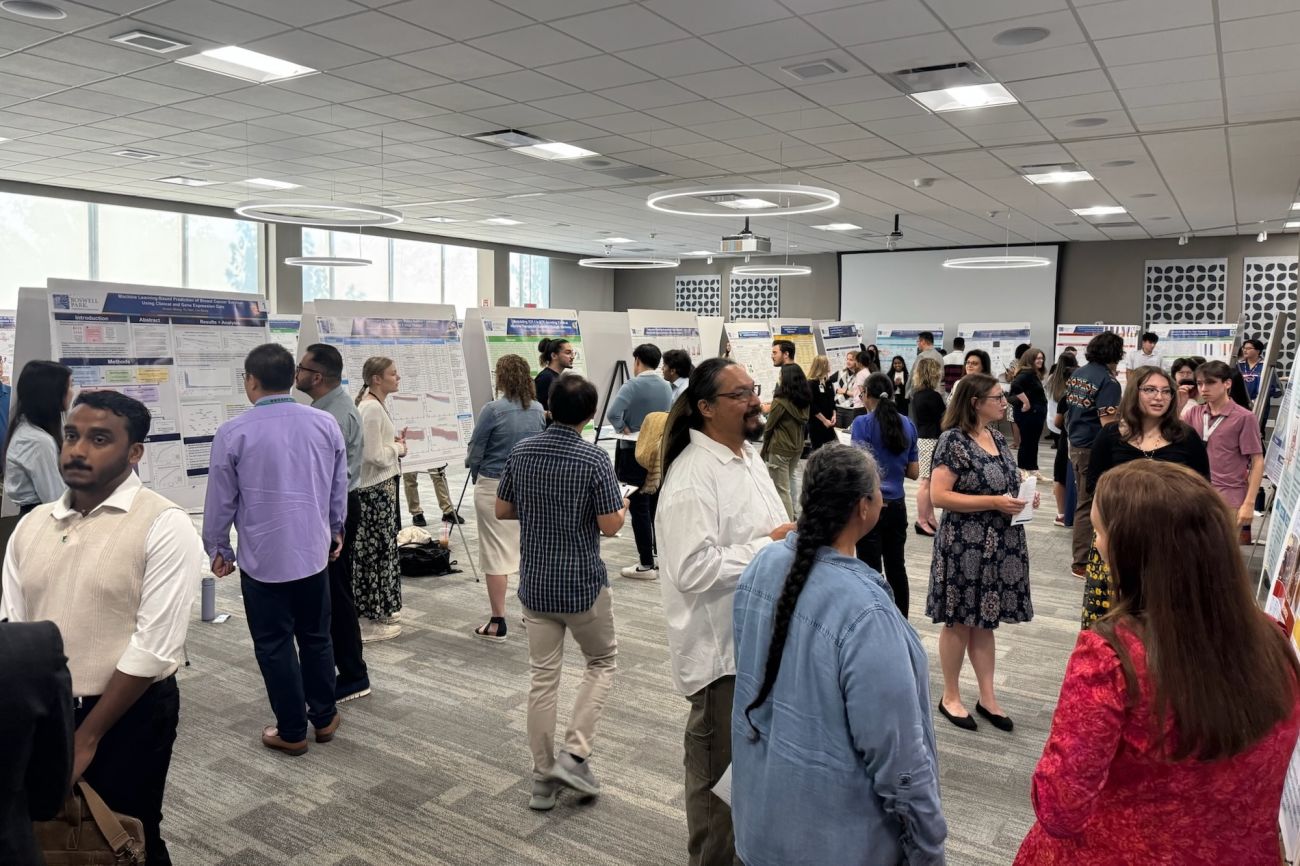 High school interns in the SURE-CAN Program present their posters 