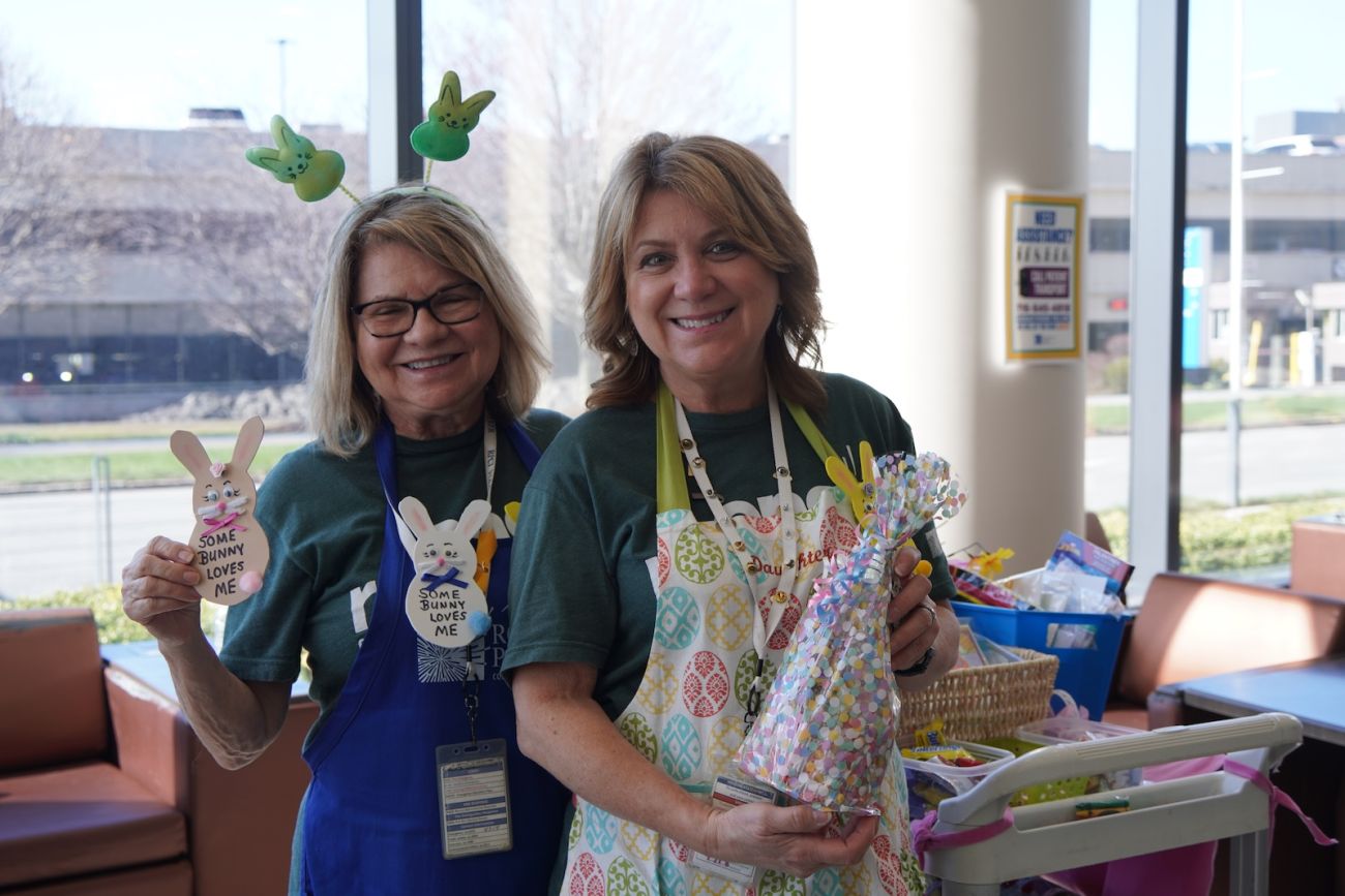 Two volunteers with Easter crafts